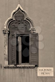 old  window grate in verona via ponte pietra