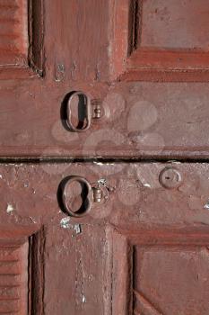   brass brown knocker and wood  door vinago  varese italy