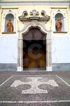  vanzaghello italy   church  varese  the old door entrance and mosaic sunny daY rose window