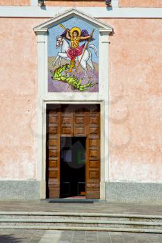 church  mornago varese italy the old door entrance and mosaic