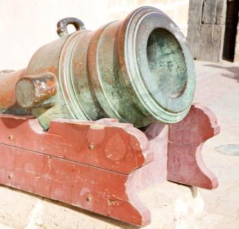 in africa morocco  green bronze cannon and the blue sky