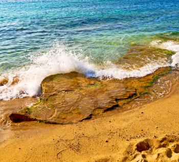 in      greece  the mykonos island rock sea and beach    sky