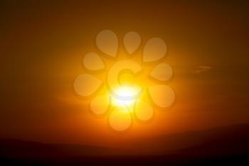  the blurred  sun falling down arabian mountain  in   oman  