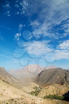  gorge and canyon the deep cloudy sky    in oman the old   mountain 