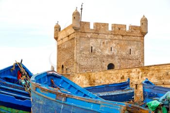   boat and sea in africa morocco old castle brown brick  sky
