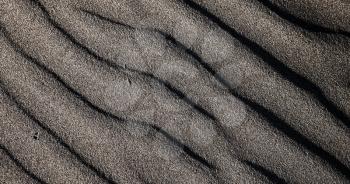 spain texture abstract of a  dry sand and the beach in lanzarote 
