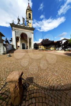 in  the cairate   old   church  closed brick tower sidewalk italy  lombardy  