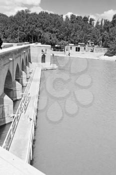 blu in iran  the old bridge and the river antique construction near nature