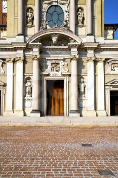 lombardy    in  the busto arsizio  old   church  closed brick tower sidewalk italy 
