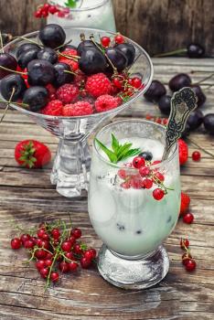 sweet dessert of ice cream per glass and fresh berries, cherries,currants,strawberries.