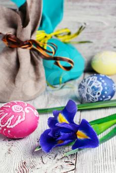 Painted Easter eggs,a iris flower and pouches with ears