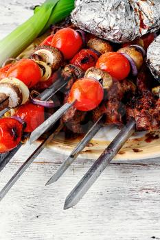 Beef fried on the coals,strung on skewers with vegetables