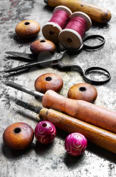 Wood beads jewelry and tool for making iron on vintage background