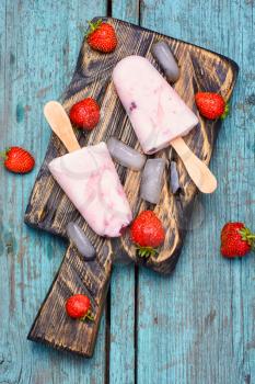 Ice cream on the kitchen chalkboard and berries fresh strawberries