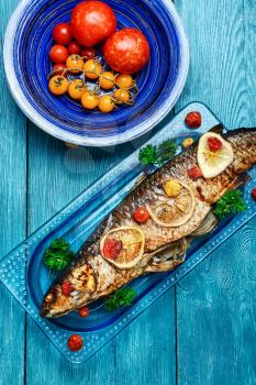 Baked in tomatoes and spices whole fish