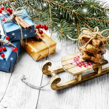 Christmas card with old fashioned Christmas sleigh of Santa Claus and Christmas gifts