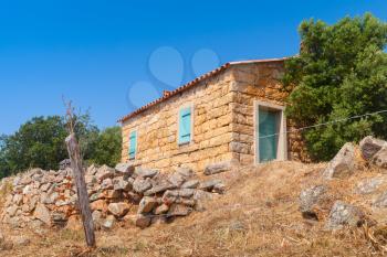 Typically rural landscape of South Corsica, France. Old stone house and trees
