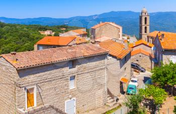 Corsican village landscape, living houses and church. Petreto-Bicchisano, Corsica, France