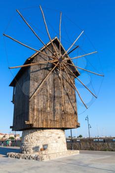 Ancient wooden windmill on the sea coast, the most popular landmark of old Nessebar town, Bulgaria