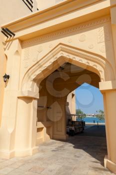 Yellow house facade with classical Arabic style arch