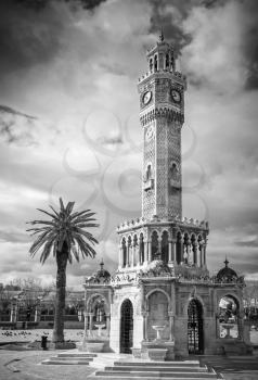 Konak Square view with old clock tower. It was built in 1901 and accepted as the official symbol of Izmir City, Turkey. Black and white photo