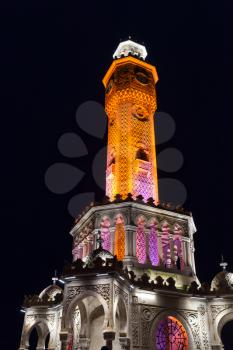 Night view of Konak Square. Illuminated historical clock tower, it was built in 1901 and accepted as the official symbol of Izmir City, Turkey