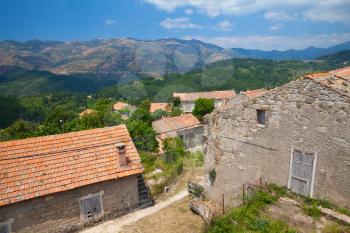 Rural landscape of South Corsica, old stone houses and mountains on a background. Zerubia village, France