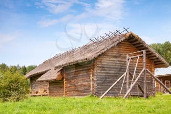 Russian rural wooden architecture example, old barns and swing