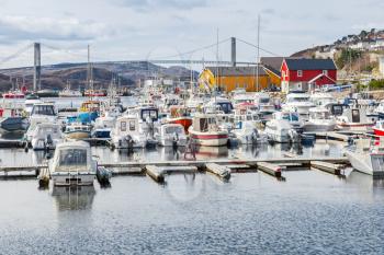 Rorvik, Small Norwegian fishing village, wooden houses and moored boats on the North sea coast 