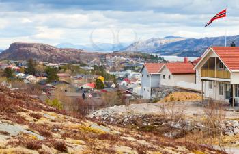 Rorvik. Fishing Norwegian town with colorful wooden houses on rocky hills
