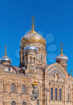 Facade and golden domes of Assumption Church on Vasilevsky Island. Orthodox church in Saint-Petersburg, Russia