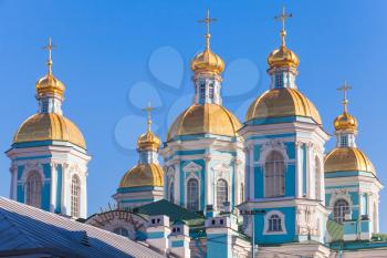 Orthodox St. Nicholas Naval Cathedral, facade fragment with golden domes, St. Petersburg, Russia