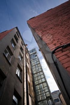 Construction of external lift shaft typical for old part of Saint-Petersburg, Russia