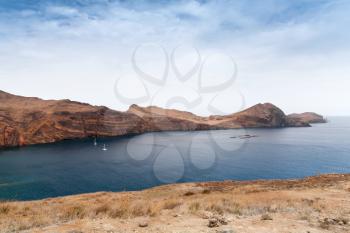 Sailing yachts in bay of Ponta de Sao Laurenco. Coastal landscape of the municipality of Machico in the Portuguese island of Madeira