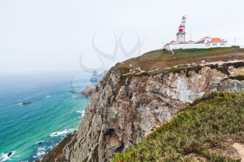 Landscape of Cabo da Roca with the lighthouse on background, it is a popular tourist attraction and limit of continental Europe