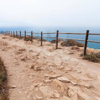 Old wooden railings on Cabo da Roca, Westernmost point Portugal and Europe