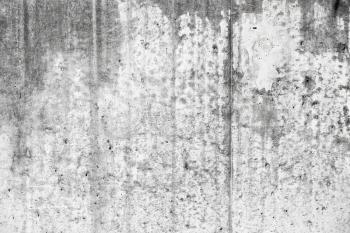 Old grungy concrete wall with wet stains, frontal background photo texture