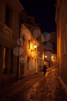 Street fragment at night in old town of Tallinn, Estonia