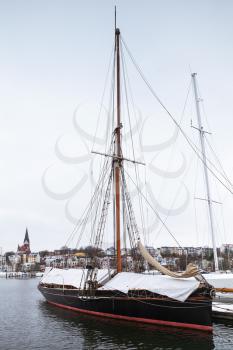 Sailing yachts moored in marina in winter. Flensburg, Germany