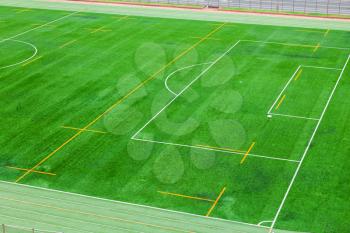 Empty soccer field background with an artificial turf