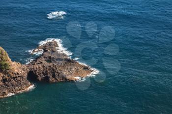 Coastal rocks of Madeira island, Bridal Veil Falls viewpoint. Portugal