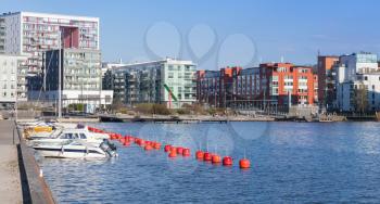 Stockholm cityscape with pleasure boats and modern living houses in. Sodermalm district