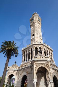Clock tower under blue sky, it was built in 1901 and accepted as the official symbol of Izmir City, Turkey