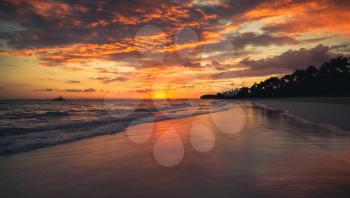 Orange sunrise over Atlantic Ocean coast. Bavaro beach, Hispaniola Island. Dominican Republic