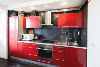 Modern kitchen room interior. Black, red and white design