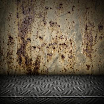 Grunge interior with rusted metal wall and diamond metal plate floor