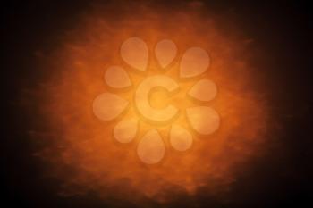 Abstract background with orange glowing spot light