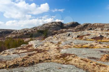 Norwegian mountain landscape with rocks under blue sky