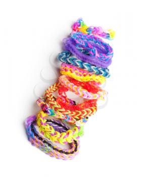 Group of colorful rubber band bracelets isolated on white, trendy kids fashion accessories 