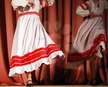 Bright fragment of fast Russian folk dance with red-white girls waved skirt